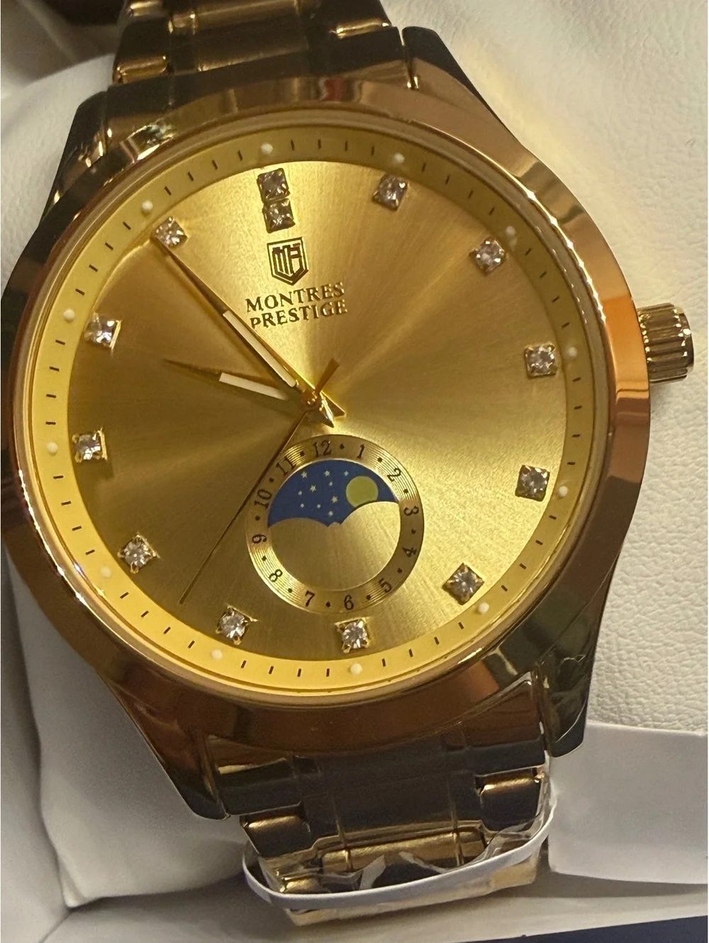 Montres Prestige gold-tone watch with moonphase dial